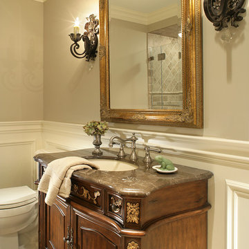 Powder Room with Ornate Mirror and Wall Sconces