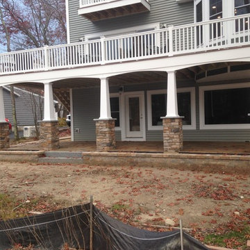 Lakeside patio with stone column bases