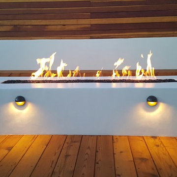 Fire pit with lighting, bench, deck and new stucco wall