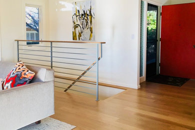 Design ideas for a modern staircase in San Francisco with metal railing.