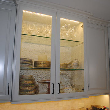 Glass door cabinet to showcase clients vintage dishes and giving sparkle
