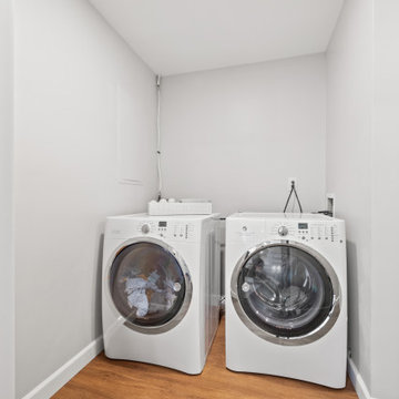 Compact Laundry Nook Under Sloped Ceiling