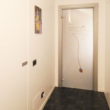 porte interne effetto filomuro e abbinamento porta in vetro