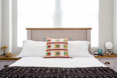 Example of an eclectic bedroom design in London