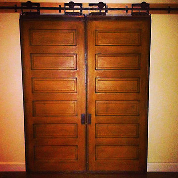 Restored farmhouse door with original antique pocket door sliders