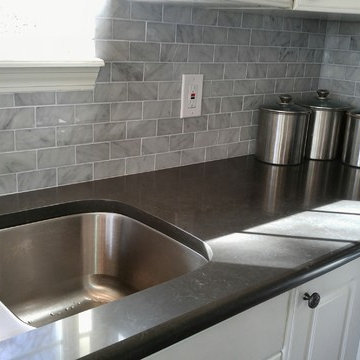 Caesarstone Piatra Grey Quartz Countertop with Carrara Marble Subway Tile