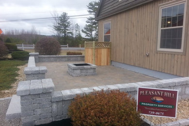 Slab paver patio with knee wall, pillars & fire pit