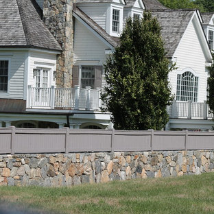 Design ideas for a large traditional backyard full sun garden in New York with a retaining wall.