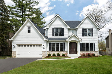 Large elegant white two-story mixed siding house exterior photo in Chicago with a hip roof and a shingle roof