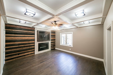 Living room - mid-sized craftsman enclosed dark wood floor living room idea in Edmonton with brown walls, a ribbon fireplace, a plaster fireplace and a wall-mounted tv