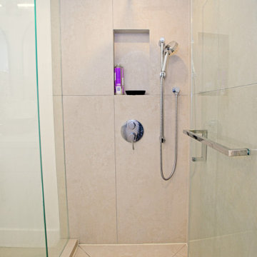 Glass Corner Shower with Envelope-Cut Tile Floor | The Junction