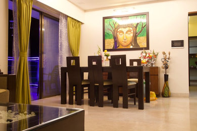 This is an example of a world-inspired dining room in Pune.