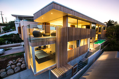 Photo of a mid-sized contemporary home design in Brisbane.