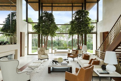 Example of a huge transitional enclosed medium tone wood floor and white floor living room design in Denver with a standard fireplace, a stone fireplace, no tv and white walls