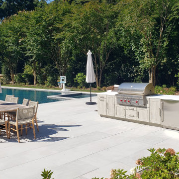 A GRAND SLAM OUTDOOR KITCHEN BY THE TENNIS COURT IN EAST HAMPTON, NY