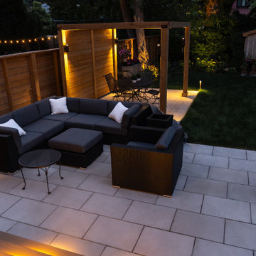 Modern Cedar Pergola, Porcelain Patio & Outdoor Lighting Backyard Renovation