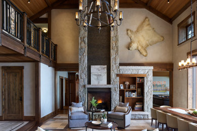 Huge arts and crafts living room photo in Other with a stone fireplace