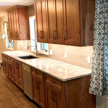 Dura Supreme Cabinets Knotty Alder Butternut Romanix Granite Galley Kitchen