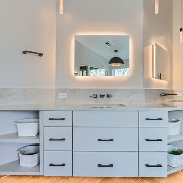 Modern Spa-Inspired Primary Bathroom with Custom Lighting and Views