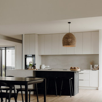 Modern Kitchen with Neutral Cabinetry and Dark Timber Island