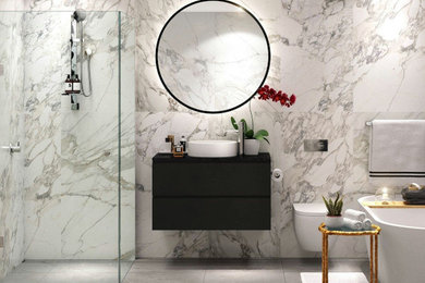 Photo of a large modern master bathroom in Sydney with black cabinets, a freestanding tub, a corner shower, a wall-mount toilet, marble benchtops, a hinged shower door and black benchtops.