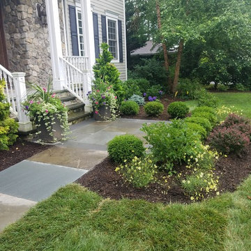 Patio with stone wall and fire pit