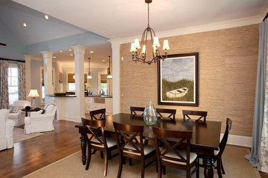 Example of a transitional light wood floor dining room design in Austin