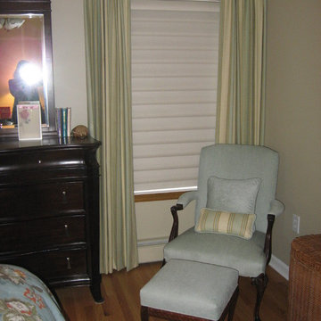 Draperies over Vignettes. Reupholstered Chair with Custom Pillows.