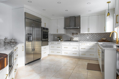 Design ideas for a large transitional u-shaped eat-in kitchen in Toronto with an undermount sink, shaker cabinets, white cabinets, quartz benchtops, grey splashback, subway tile splashback, stainless steel appliances, white benchtop and a peninsula.