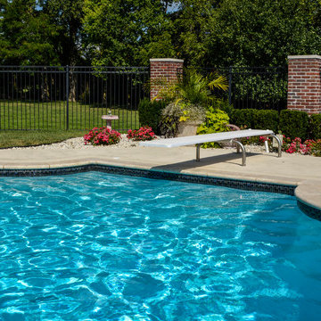 Grecian swimming pool with L, diving board and hot tub
