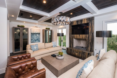 Inspiration for a mid-sized transitional formal and enclosed dark wood floor and brown floor living room remodel in Orange County with white walls, a standard fireplace, a stone fireplace and a wall-mounted tv