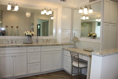Corner shower - mid-sized transitional master white tile and porcelain tile porcelain tile corner shower idea in Miami with shaker cabinets, white cabinets, an undermount tub, a one-piece toilet, white walls, quartz countertops and an undermount sink
