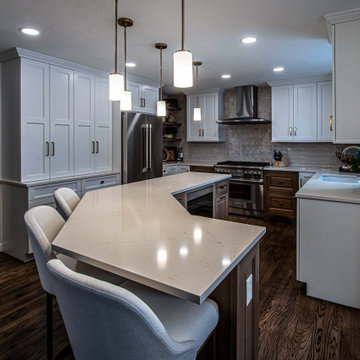 Two Tone Kitchen with Floating Shelves and Island Seating and Updated Fireplace