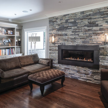 Rustic Living Room With Warm Stone Fireplace