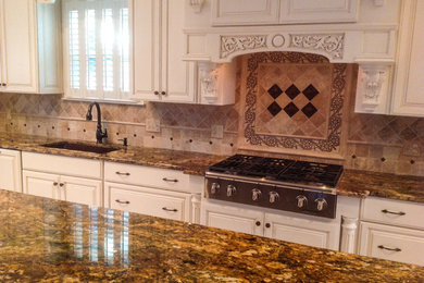 Inspiration for a kitchen remodel in Nashville with granite countertops, beige backsplash and stone tile backsplash