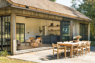 Patio - country patio idea in New York