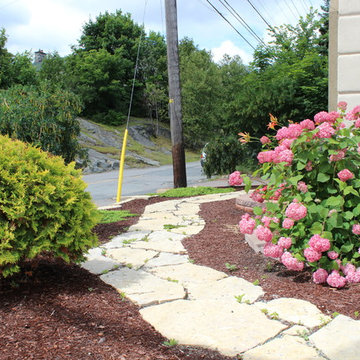 Natural Stone Path and Wall with Brown Mulch Garden