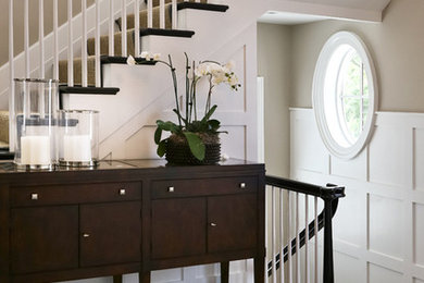 Inspiration for a mid-sized contemporary foyer in DC Metro with dark hardwood floors and beige walls.