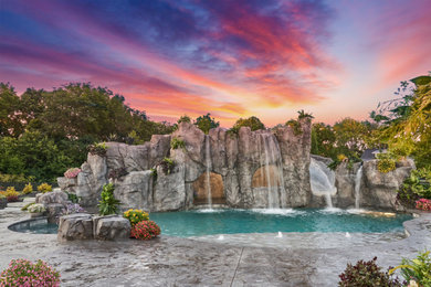 Inspiration for a mid-sized backyard stamped concrete and custom-shaped water slide remodel in Cincinnati