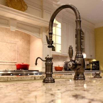 Traditional Mediterranean Kitchen with high-end pull-down faucet in antique pewt