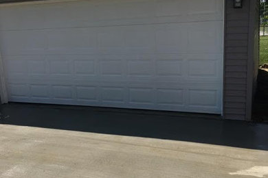 Garage - mid-sized contemporary detached two-car garage idea in Detroit