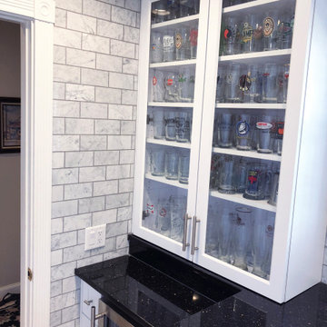 Marble Laundry room with built in front loading machines