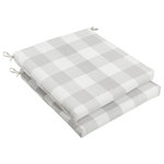 Mozaic Company - Stewart Grey Buffalo Plaid Chair Cushion, Set of 2 - This wide checkered, white and light Gray buffalo plaid pattern will add the perfect traditional accent to your decor. Classic buffalo plaid print adds an energizing linear look to this outdoor chair cushion set. Beautifully constructed with a pure recycled fiber fill, the outdoor fabric covers provide essential protection against sun damage and mildew, offering a long life of outdoor use. Attached ties secure the cushion and avoid slippage, while the sewn enclosures offer a secure finish. The dynamic plaid look is a great match for outdoor decor, but also a nice look for casual interior spaces in need of a boost.