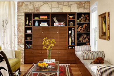 This is an example of a midcentury living room in Austin with beige walls.