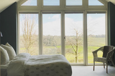 This is an example of a farmhouse bedroom in Sussex.