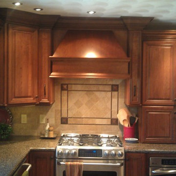 Omega Cabinetry. Destin door, Cherry wood, Nutmeg stain.