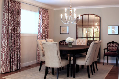 This is an example of a large transitional separate dining room in San Francisco with beige walls, dark hardwood floors and no fireplace.