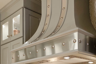 Eat-in kitchen - large traditional galley light wood floor eat-in kitchen idea in Austin with an undermount sink, green cabinets, quartzite countertops, multicolored backsplash, stainless steel appliances and no island