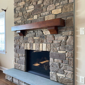 Pre Fab Fireplace Extraction. Replaced With Gas Fireplace With Custom Stone.