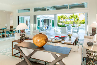 Inspiration for a large mediterranean open concept living room in Tampa with white walls, travertine floors and no tv.